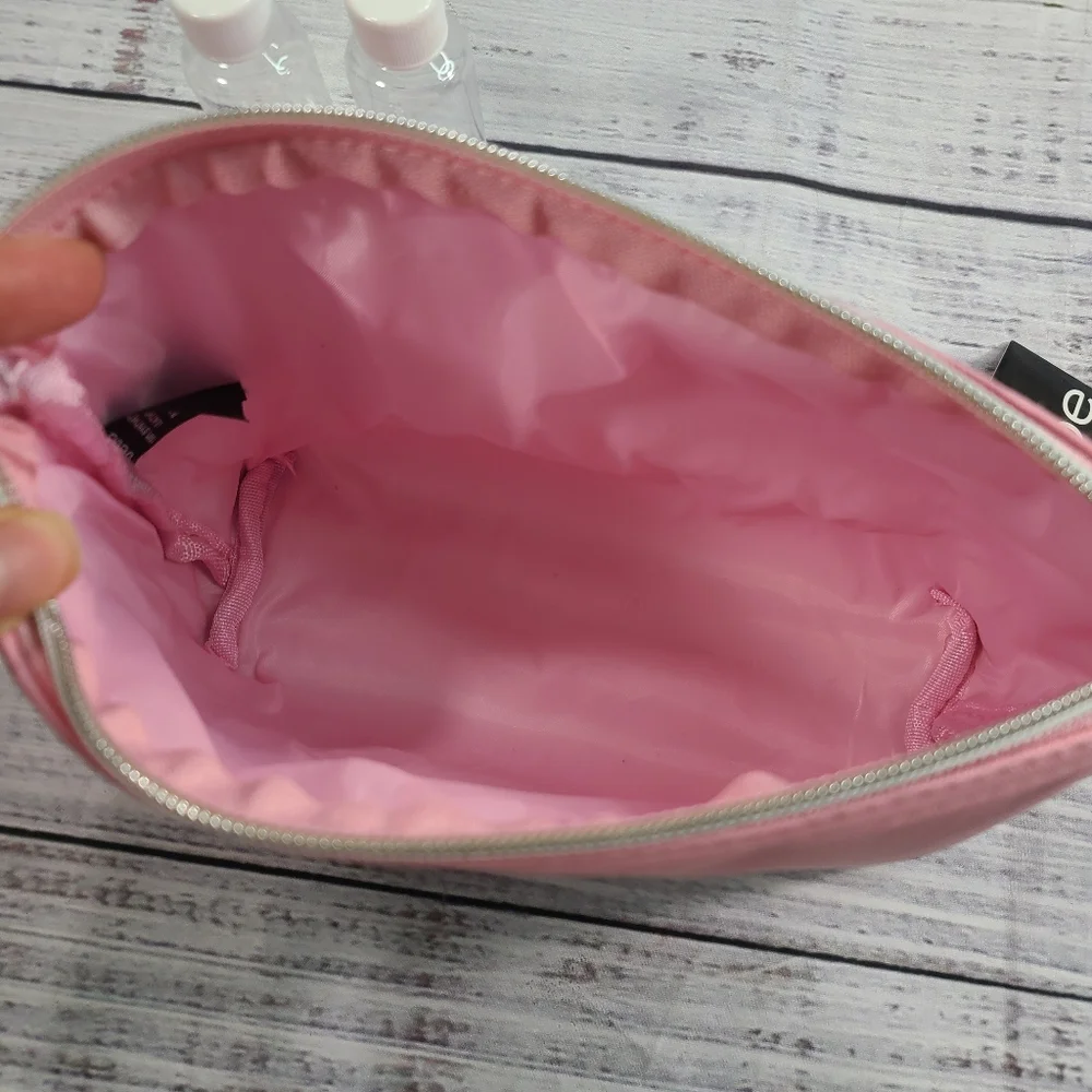 Bebe Pink Cosmetic Bag Sleek Design Zipper Closure With Two 1.6 Oz Bottles NWT